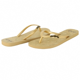 Ed Hardy Capistrano  Flip Flop for Women - Gold - Simple and classic styling craft the Capistrano flip flops from Ed Hardy. These easygoing sandals feature a durable rubber upper with toe post attached to a cushioned graphic-embossed footbed for lasting comfort and support. It makes a great traveling companion, easily tuckable into your weekend tote or carry-on.